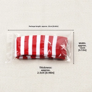 Detailed view of red and white striped knee high socks in transparent polybag packaging