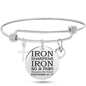 Detail of silver wire bracelet with engraved Bible verse charm and heart pendant