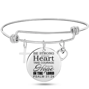 Detail of silver bangle showing engraved Psalm 31:24 quote with cross and heart charms