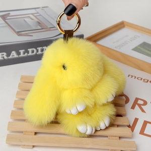 Detailed plush yellow bunny keychain with soft faux fur and elegant gold metal ring