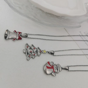 Detailed Christmas necklaces featuring silver bell, hollow tree and snowman pendants