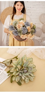 Detail of silk dahlia bouquet with dense petals in soft orange and blue tones