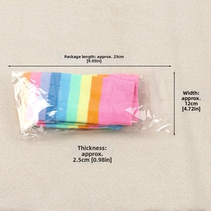 Detailed view of rainbow striped knee socks folded in transparent plastic packaging