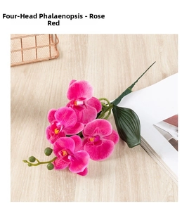 Detailed view of rose red 4-head artificial phalaenopsis orchid on a wood surface