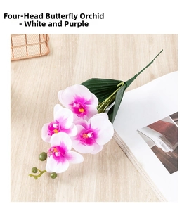 Top view of realistic white and purple 4-head Phalaenopsis orchid on a light wood desk
