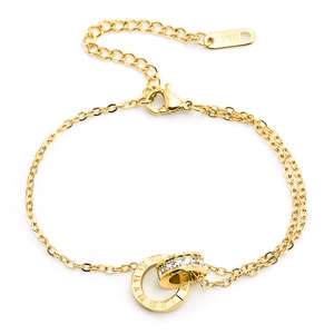 Detail of gold double-layer stainless steel necklace with Roman numerals and zircon stones