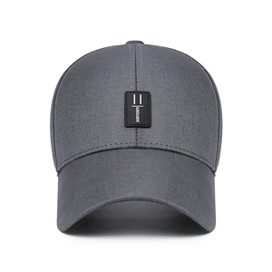 Dark gray baseball cap with a rectangular logo patch and durable structured cotton fabric