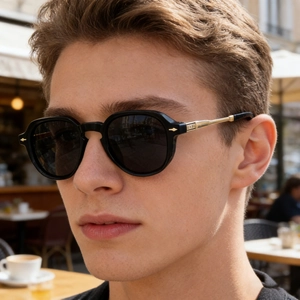 Close-up of polarized sunglasses featuring gold metal temples and arrow-shaped hinges