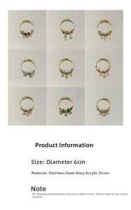 Detail view of gold charm bracelets with heart, star, and gemstone beads on 6cm adjustable band