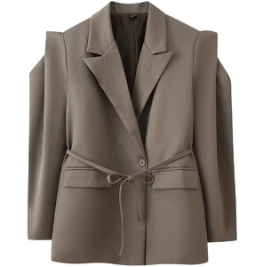 Detailed view of coffee brown tailored blazer with padded shoulders and waist tie belt