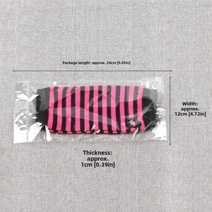 Detail view of pink and black striped knitted arm warmers in 24x12cm packaging