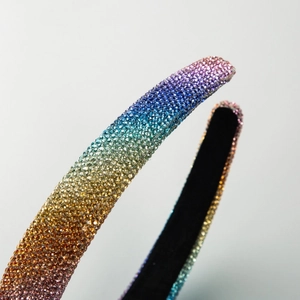 Rainbow gradient crystal headband featuring micro rhinestones and black velvet lining