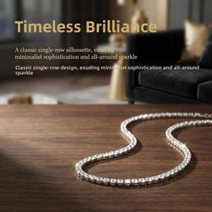 Macro view of gold-plated tennis necklace with sparkling round-cut zircon stones