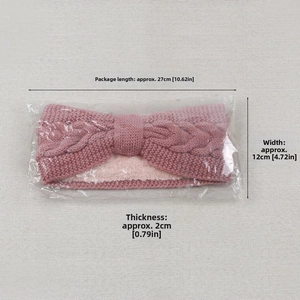 Detail of rose pink cable knit headband showing warm fleece lining and dimensions