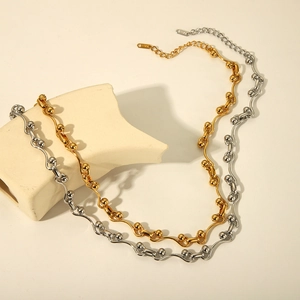 Detailed view of wave link chain necklaces in gold and silver finish with S925 tag
