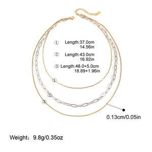 Detailed view of triple-layered 18K gold and silver plated stainless steel necklaces