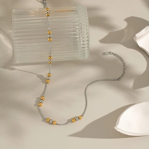 Collana minimalista con sfere bicolore su catena serpente placcata in oro 18K e argento