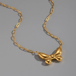Polished 18K gold plated butterfly pendant with elegant paperclip chain detail