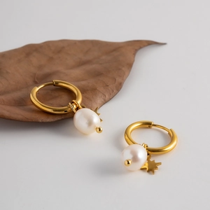 Gold hoop earrings featuring natural freshwater pearls and star pendants for women