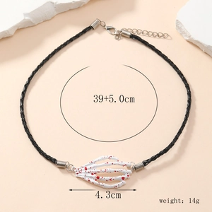 Detailed view of gothic choker with a skeleton hand pendant and bloody red splatter effect