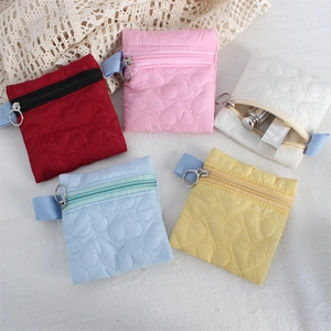 Quilted heart pattern mini pouch set in five pastel colors with zipper closure