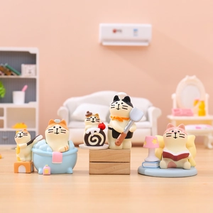Set of four cute cat miniatures in various lifestyle scenes for desktop decor