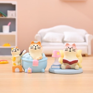 Miniature resin cat figurines showing cute bathing and reading scenes for desk decor