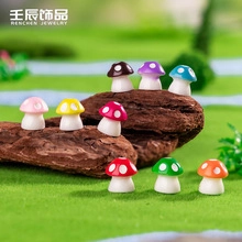Close-up of colorful resin mushroom miniatures with white polka dots for DIY decor