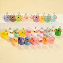 Detailed view of colorful resin duck charms with silver metal rings for DIY jewelry