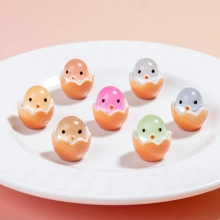 Group of seven colorful miniature resin chicks in eggshells for DIY gardening crafts