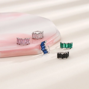 Detailed view of baguette-cut zircon ear cuffs in five colors on marble display