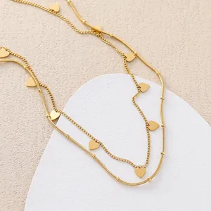 Double-layered 18k gold plated titanium necklace with heart charms and sleek bead chain