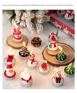 Festive Santa and snowman candles displayed on a snow-like surface for holiday decoration