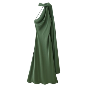 Close-up of dark green satin halter dress with elegant draped neckline and long ties