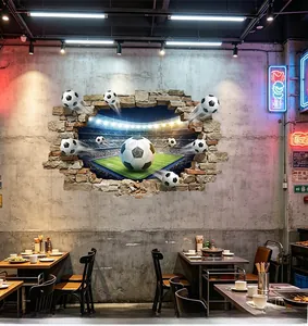 3D football breaking through brick wall sticker inside an industrial style restaurant