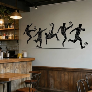 Detailed view of black football player silhouette wall stickers in a cozy bar setting