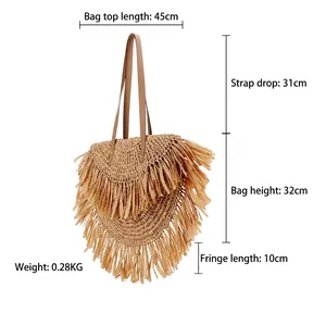Bohemian woven tassel tote bag with straw fringe and brown leather shoulder straps