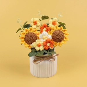 Handmade crochet sunflower bouquet in a white textured ceramic vase for home decoration