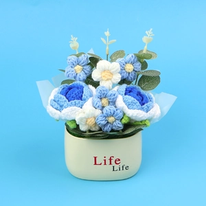 Close-up of handmade crochet rose plant in a white pot with Life Life text