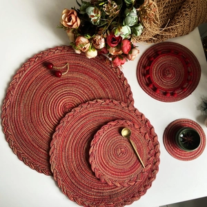 5-piece set of red bohemian woven cotton placemats and coasters with gold thread accents