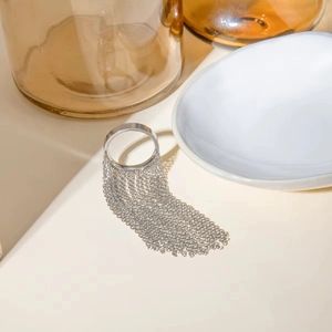 Detailed view of silver chain tassel ring with minimalist metallic fringe drop design