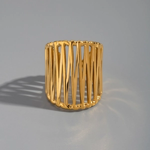 Macro view showing geometric hollow structure of wide gold stainless steel ring