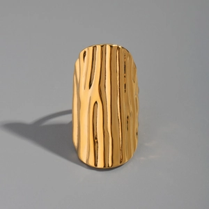 Detailed view of wide 18K gold plated ring with glossy vertical wave textures