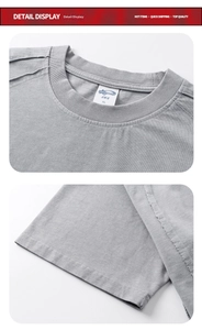 Detail view of ribbed crew neck and stitching on washed gray heavy cotton t-shirt