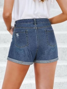 Women's stretch denim shorts in dark blue with distressed pockets and rolled hems