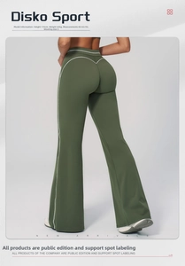 Detail view of high-waist forest green flared pants with white contrast stripes and V-cut