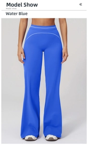 Detail of high-waisted yoga pants in bright blue with white contrast stitching