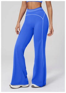 Detail showing contrast white stitching on high-waisted royal blue yoga pants