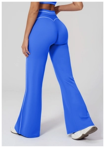 Detail of high-waisted flared yoga pants in bright blue with white contrast stripes