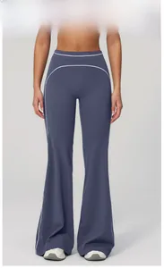 Detail of high waisted wide leg yoga pants in dusky blue with side contrast stripes